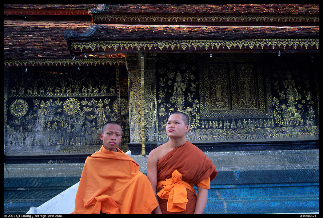 Two buddhist novice monks at Wat Xieng Thong. Luang Prabang, Laos