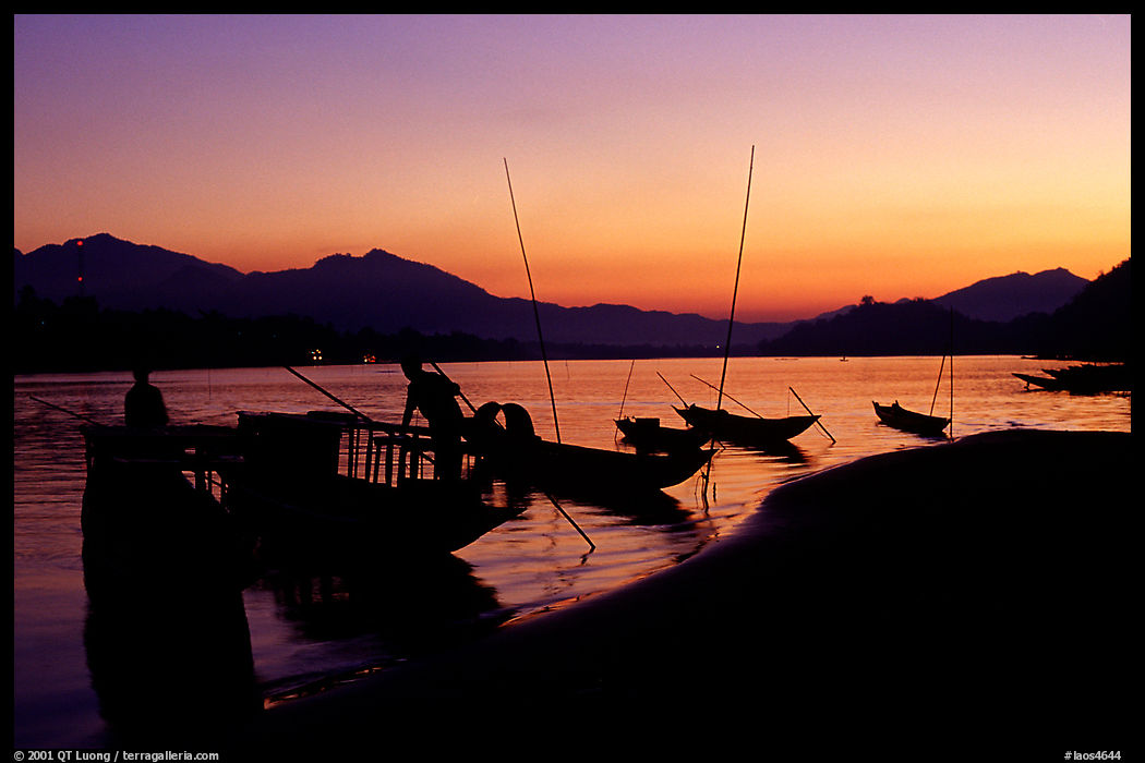 Boats, sunset on the Mekong river. Luang Prabang, Laos