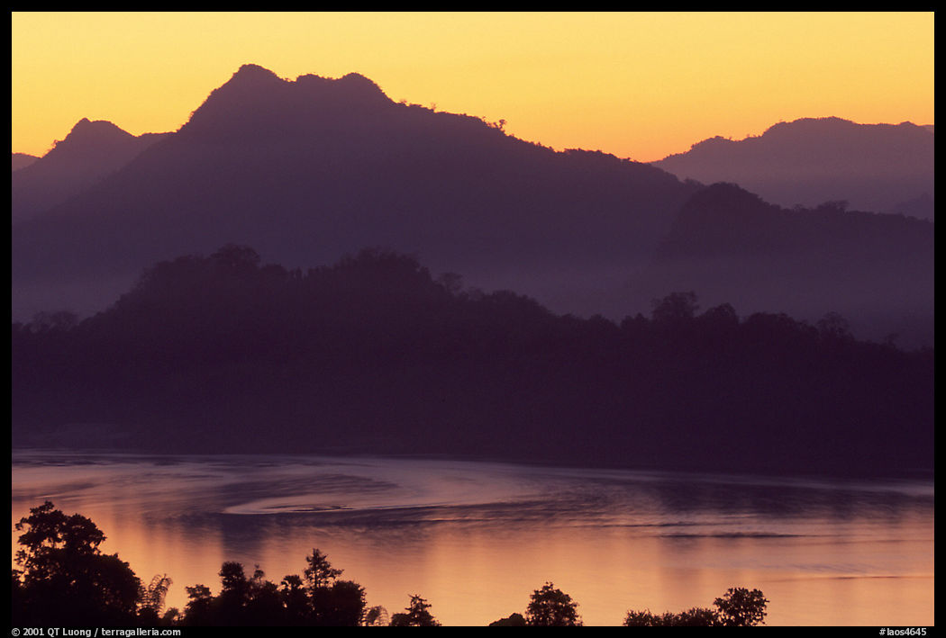 Hills, sunset on the Mekong river. Luang Prabang, Laos
