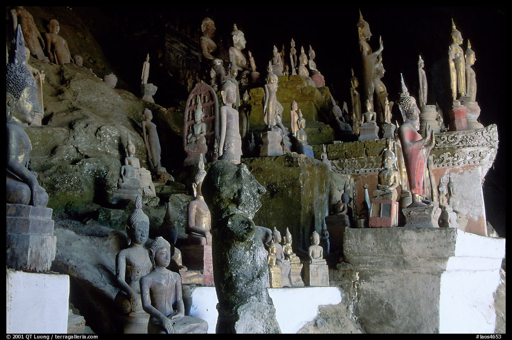 Buddha statues left by pilgrims in Pak Ou caves. Laos
