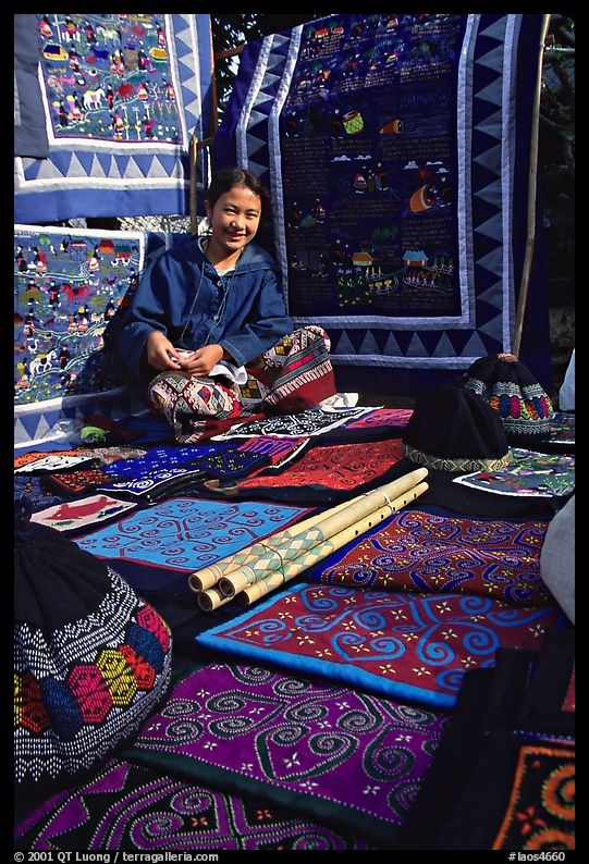Young woman sells crafts on market. Luang Prabang, Laos