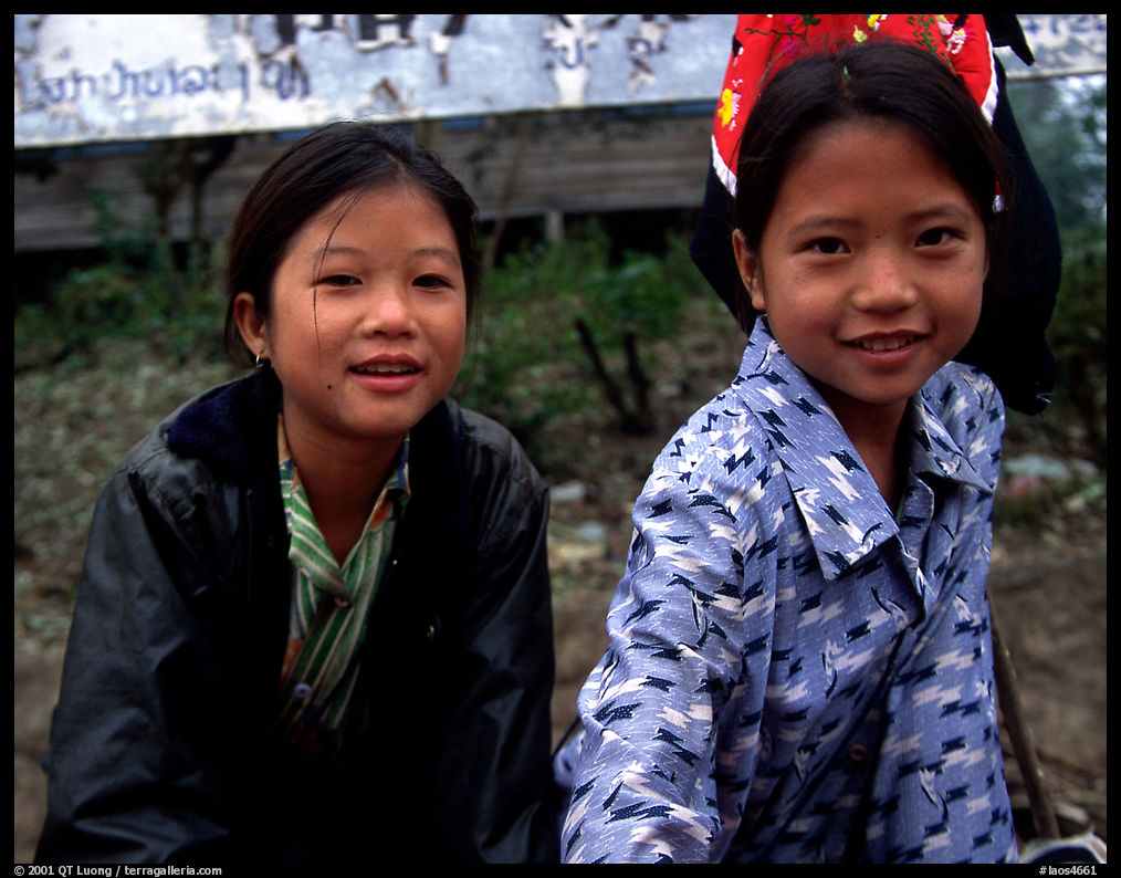 Two young girls at the market. Luang Prabang, Laos
