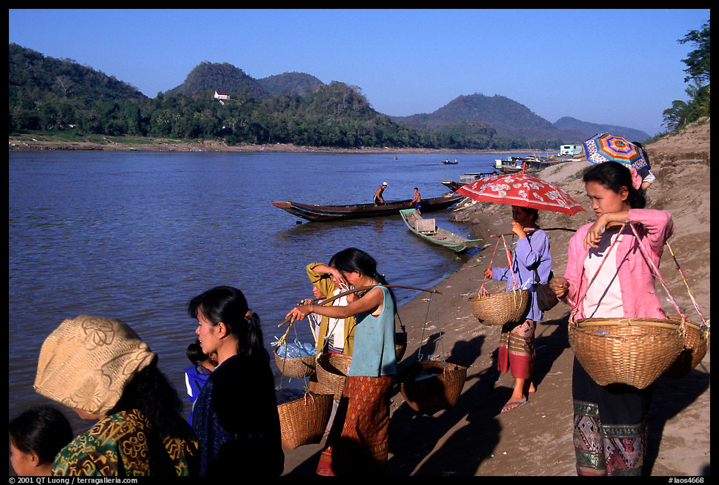 Women on the banks of the Mekong river. Luang Prabang, Laos
