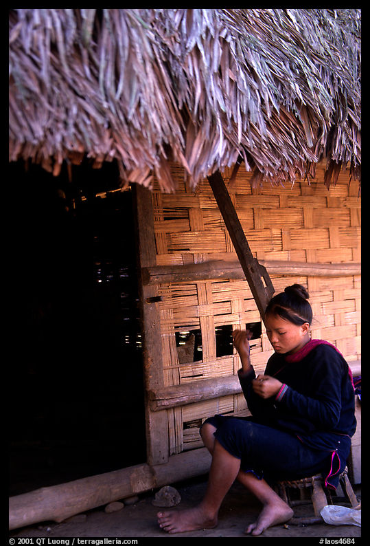 Woman of the Lao Huay tribe in front of her hut,  Ban Nam Sang village. Laos