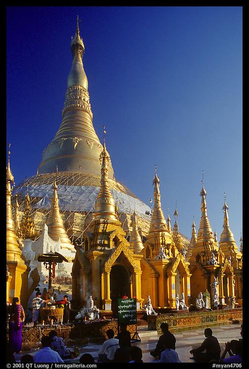 Praying at Planetery post, the Shwedagon Paya. Yangon, Myanmar