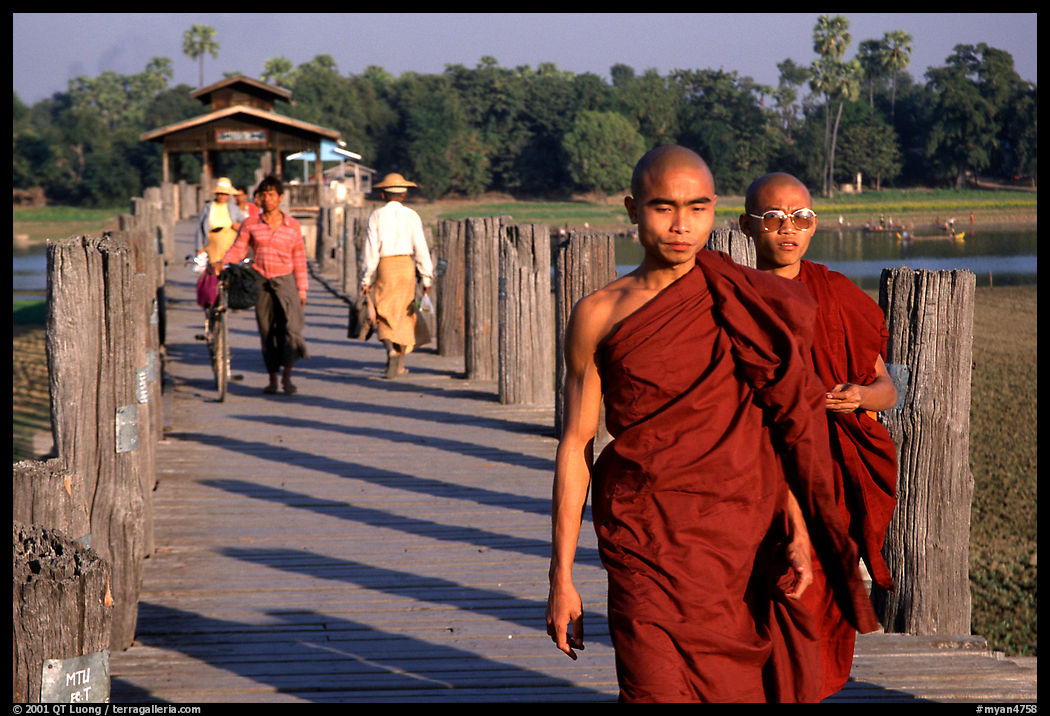 On the two century old U Bein's bridge, Amarapura. Mandalay, Myanmar