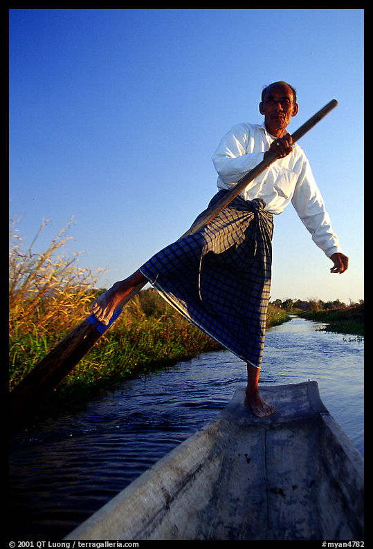 Intha man demonstrating leg-rowing. Inle Lake, Myanmar