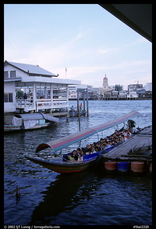 Evening commute, long tail taxi boat on the Chao Phraya river. Bangkok, Thailand