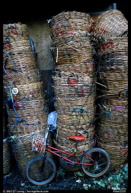 Bicycle and baskets near market. Bangkok, Thailand