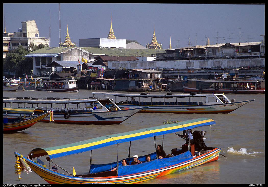 A flotilla of boats on the Chao Phraya river. Bangkok, Thailand