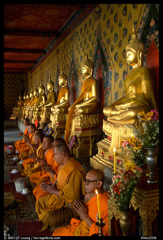 Monks in the inside gallery, Wat Arun. Bangkok, Thailand