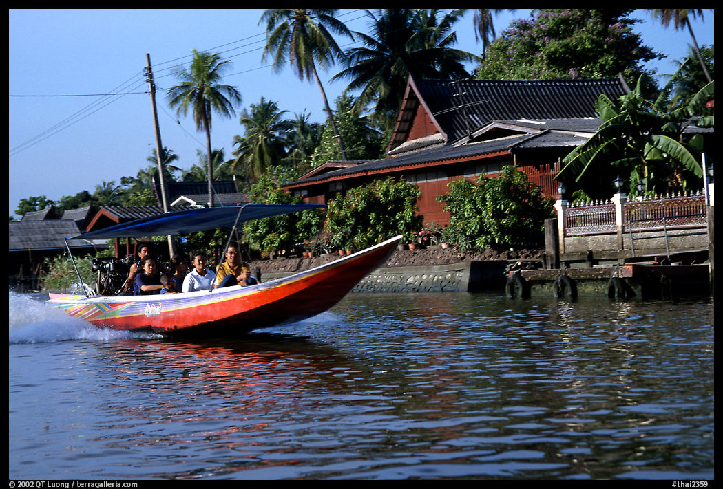 Fast boat along a khlong on Thonbury canals. Bangkok, Thailand