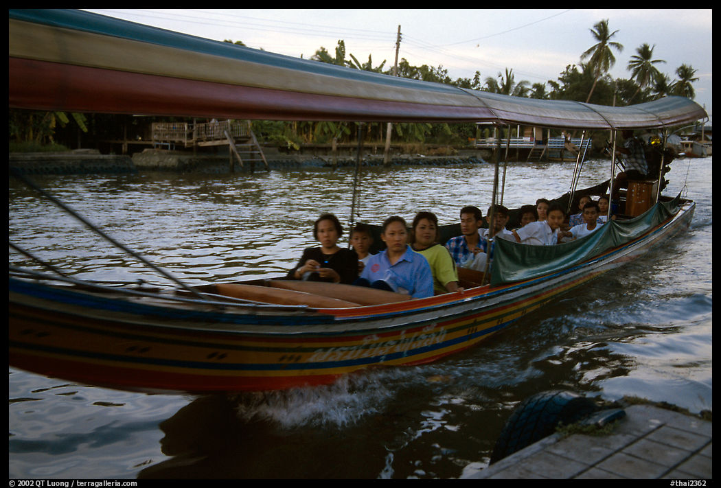 Evening commute, long tail taxi boat on the Chao Phraya river. Bangkok, Thailand
