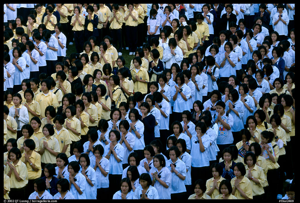 School girls during morning prayer before class. Chiang Rai, Thailand
