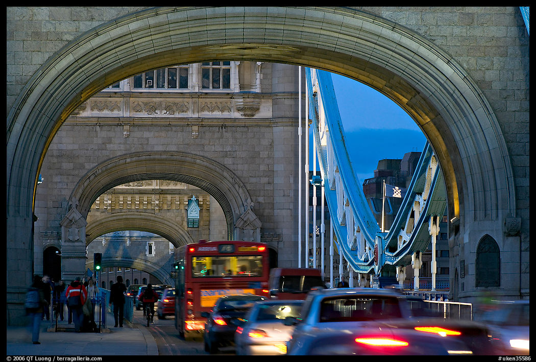 Arches and car traffic on the Tower Bridge at nite. London, England, United Kingdom