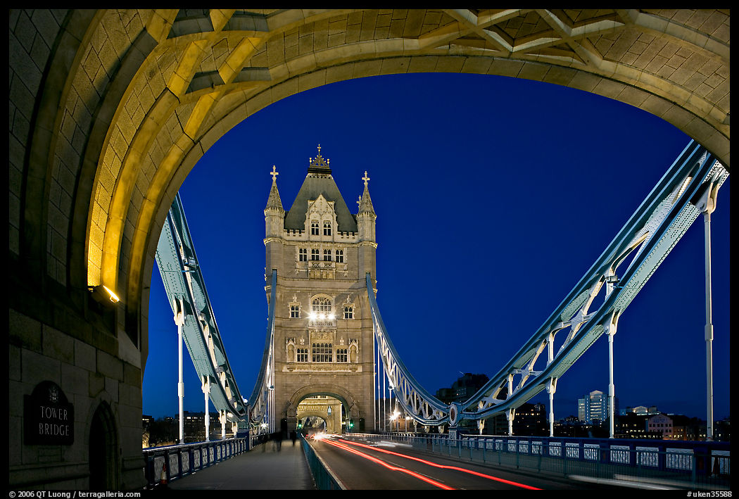 Arch and car traffic on the Tower Bridge at night. London, England, United Kingdom