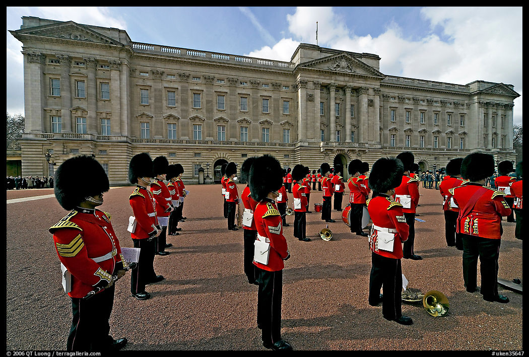 Rows of guards  wearing bearskin hats and red uniforms. London, England, United Kingdom