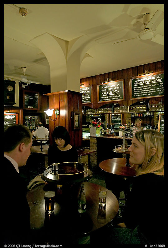 Talking around a drink in the pub Westmister Arms. London, England, United Kingdom