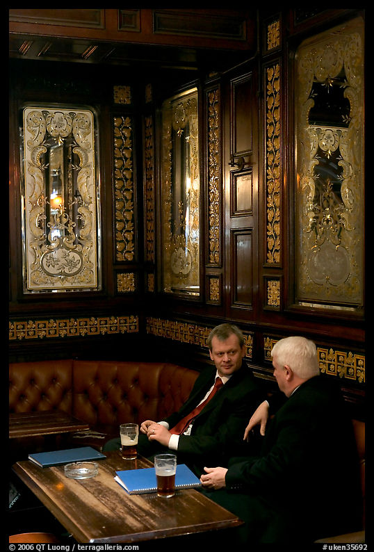 Business men talking over a beer, Victorian boozer Princess Louise. London, England, United Kingdom