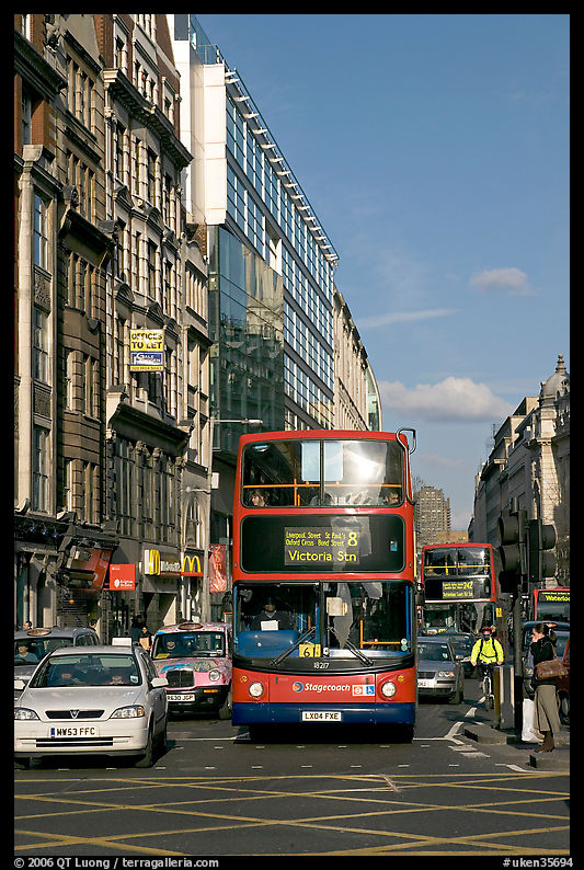 Double decker busses in a busy street. London, England, United Kingdom