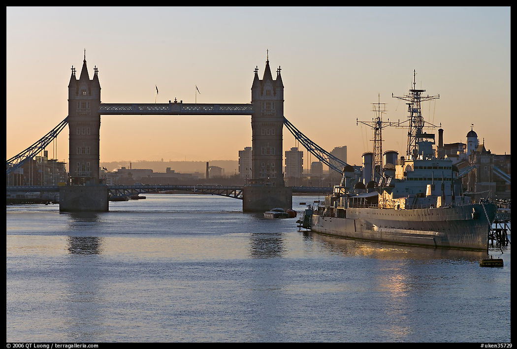 London Bridge, River Thames, and cruiser HMS Belfast at sunrise. London, England, United Kingdom