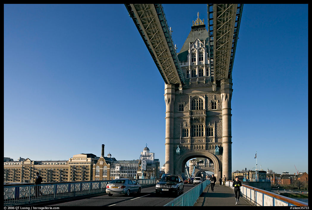 Jogger and South Tower of Tower Bridge,  early morning. London, England, United Kingdom
