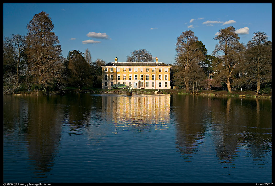 Museum No 1 reflected in lake, late afternoon. Kew Royal Botanical Gardens,  London, England, United Kingdom