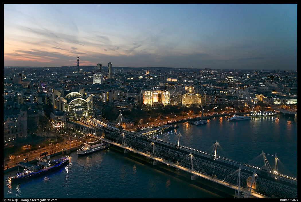 Aerial view of Charing Cross Station, Hungerford Bridge and Golden Jubilee Bridges at sunset. London, England, United Kingdom