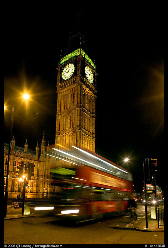 Big Ben and double decker bus in motion at nite. London, England, United Kingdom