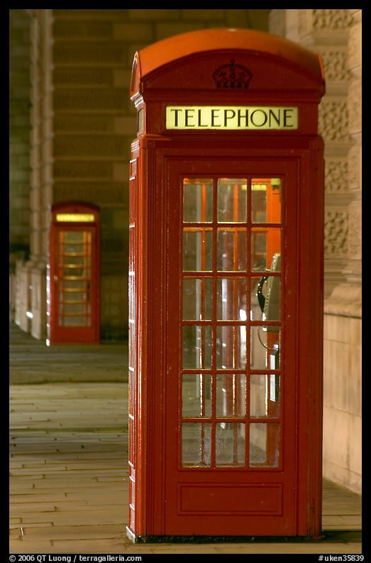 Red phone booth at night. London, England, United Kingdom