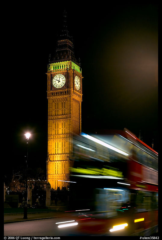Double-decker bus in motion and Big Ben at night. London, England, United Kingdom