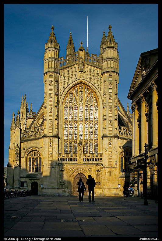 West facade of Bath Abbey with couple silhouette, late afternoon. Bath, Somerset, England, United Kingdom