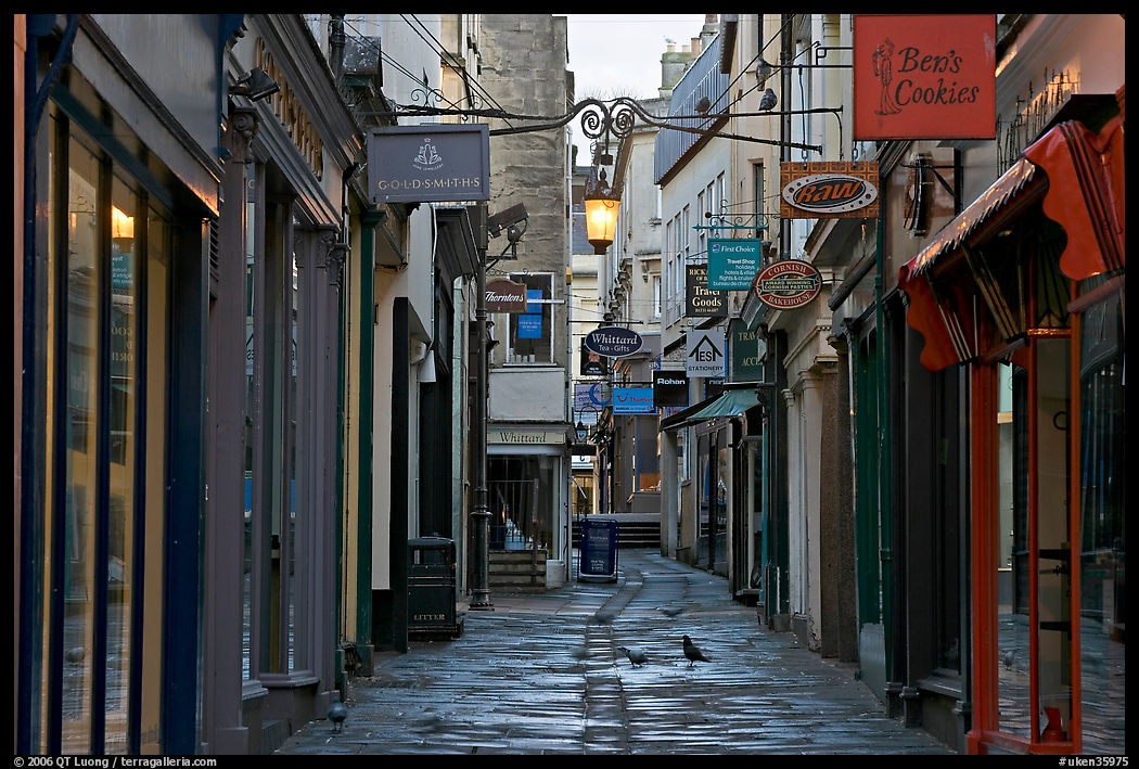 Shops lining narrow street. Bath, Somerset, England, United Kingdom
