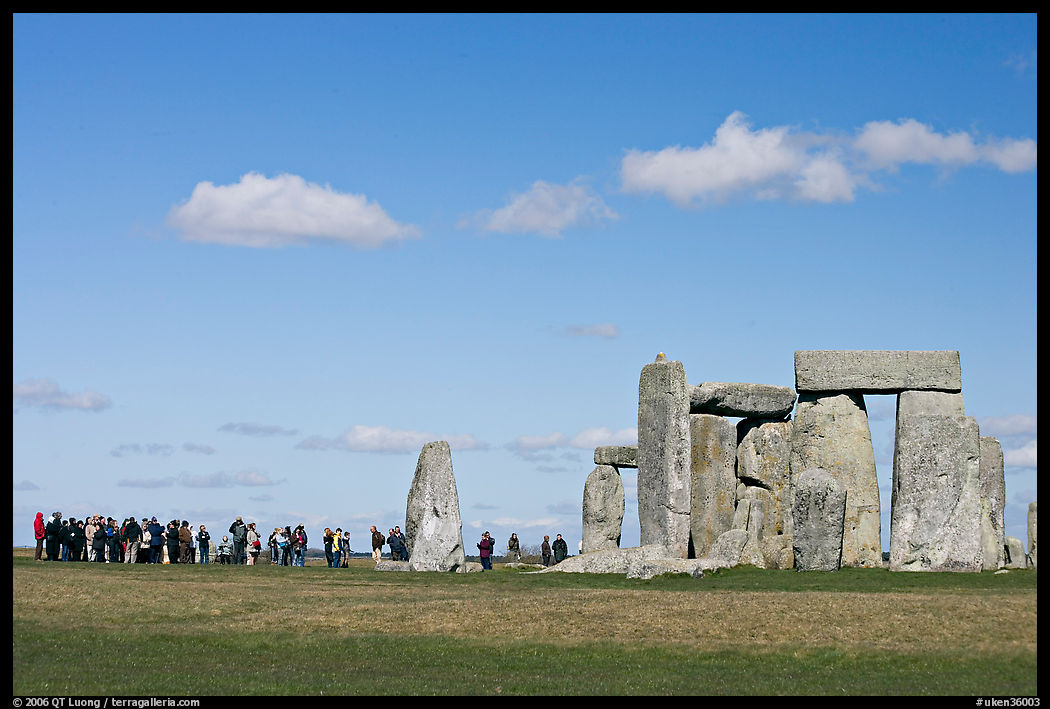 Large group of tourists looking at the standing stones, Stonehenge, Salisbury. England, United Kingdom
