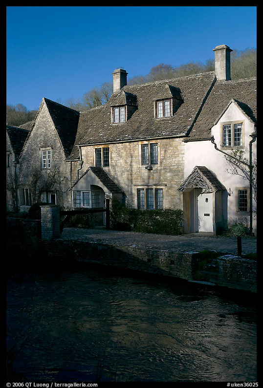 Cotswold type cottages and Bybrook River, Castle Combe. Wiltshire, England, United Kingdom
