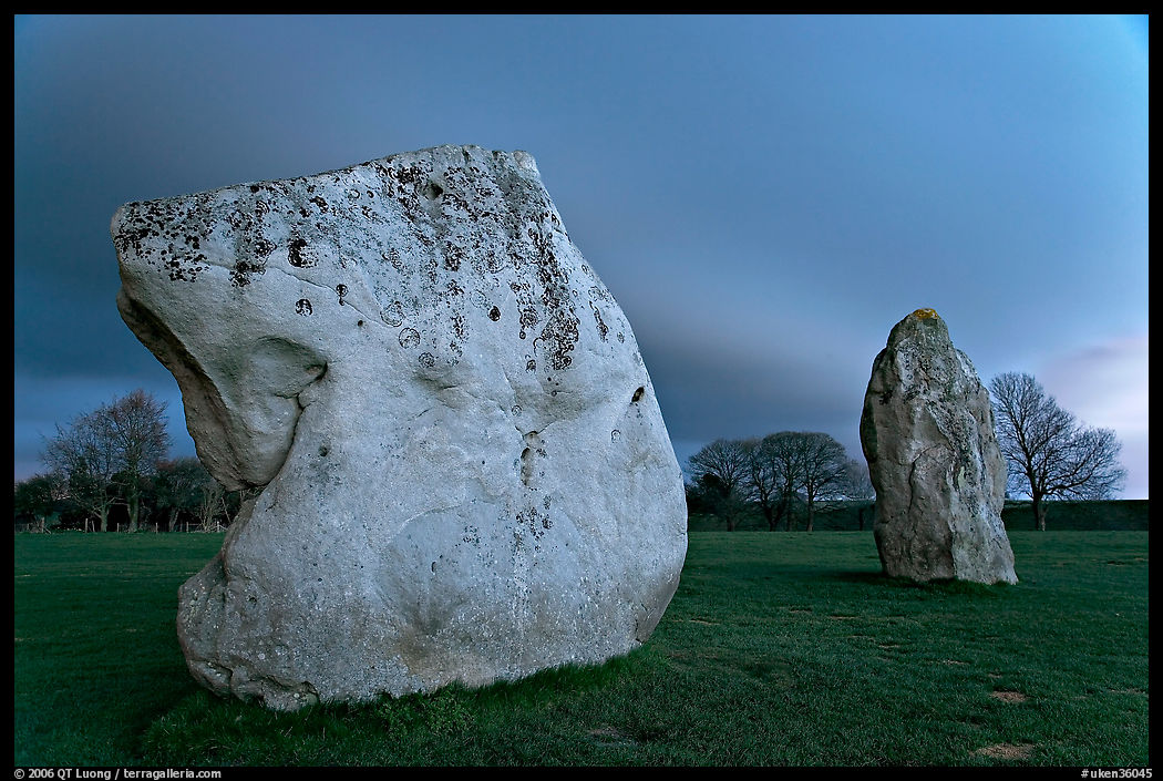 Large standing stones and brewing storm at dusk, Avebury, Wiltshire. England, United Kingdom