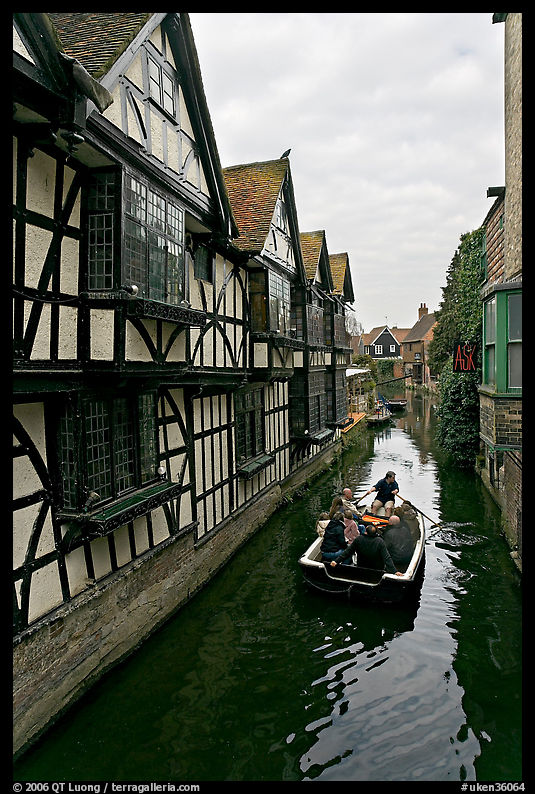 Half-timbered house, canal, and rowboat. Canterbury,  Kent, England, United Kingdom