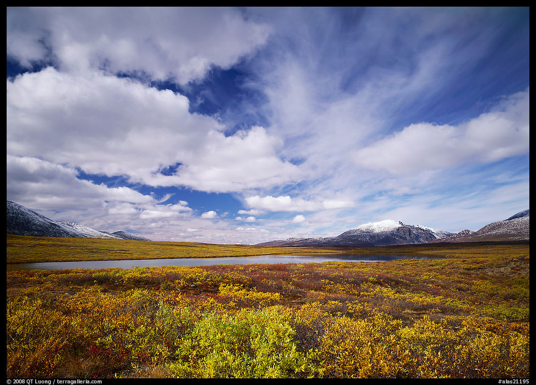 Clouds, tundra, and lake along Denali Highway in autumn. Denali Highway, Central Alaska, USA