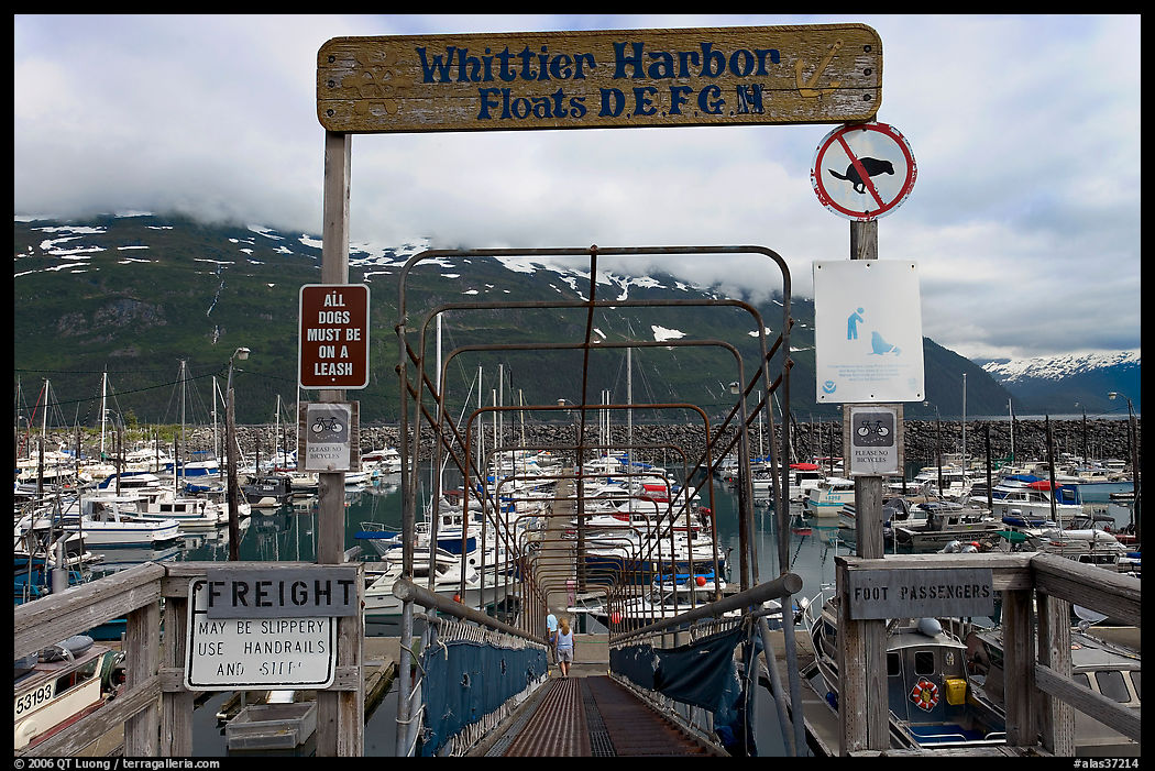 Ramp to harbor deck with Whittier sign. Whittier, Alaska, USA