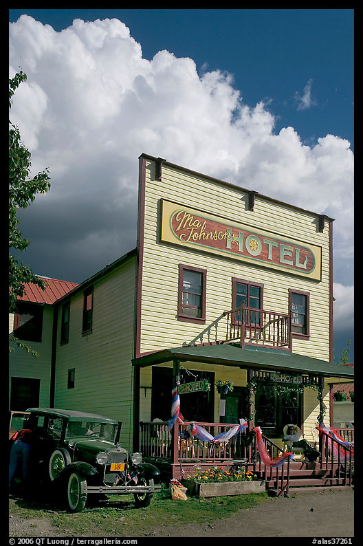 Ma Johnson hotel with classic car parked by, afternoon. McCarthy, USA