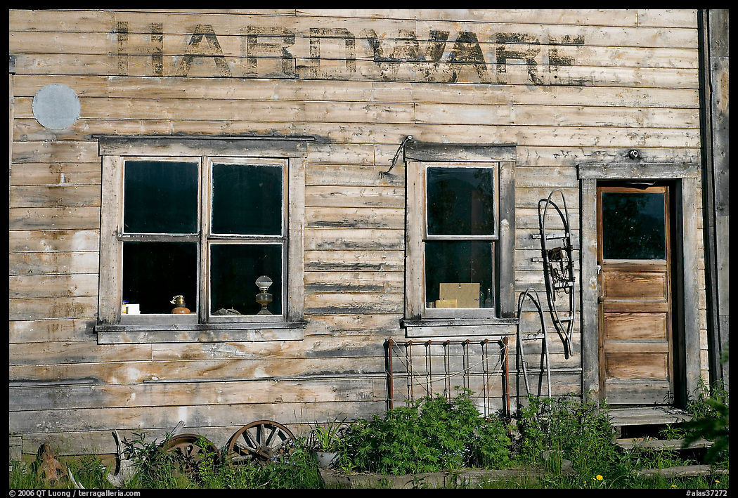 Windows and doors of old hardware store. McCarthy, USA