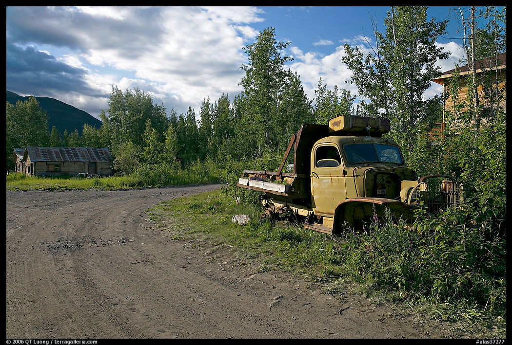 Side street with wrecked truck. McCarthy, USA