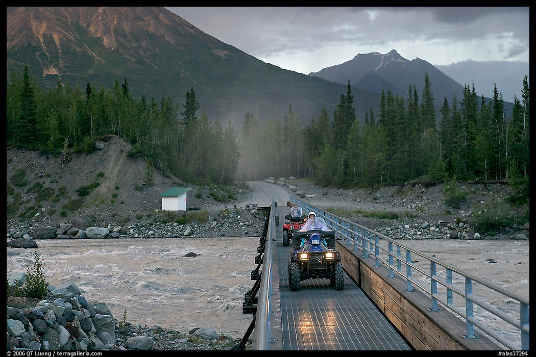 Four wheeler crossing the footbridge. McCarthy, USA