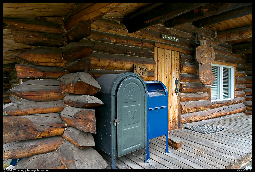 Mail boxes, log house postal office, Slana. Alaska, USA