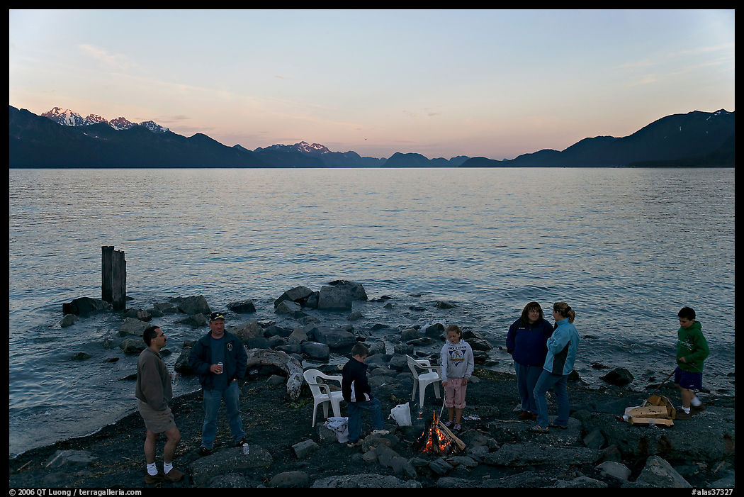 Families pickniking with fire, Resurrection Bay, sunset. Seward, Kenai Peninsula, Alaska, USA