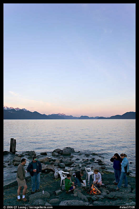 Family enjoying midnight picknik, Resurrection Bay, sunset. Seward, Kenai Peninsula, Alaska, USA