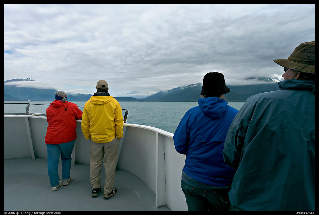 Passengers standing on deck with colorful  clothes. Seward, Kenai Peninsula, Alaska, USA