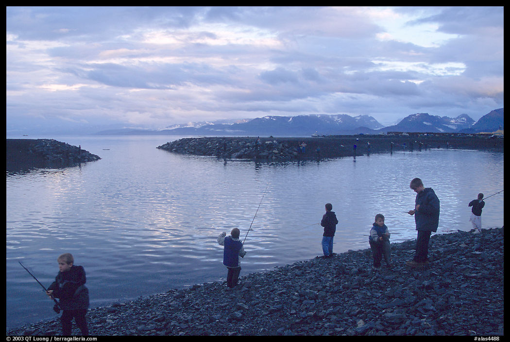 Fishing for salmon in the Spit's Fishing Hole. Homer, Kenai Peninsula, Alaska, USA