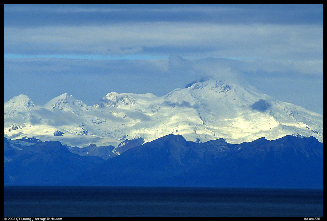 Mt Iliamna, a volcano in Lake Clark National Park, seen across the Cook Inlet. Ninilchik, Kenai Peninsula, Alaska, USA