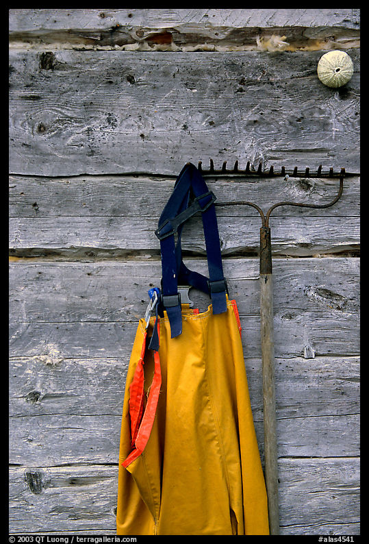 Waders hanging on a cabin wall. Ninilchik, Kenai Peninsula, Alaska, USA